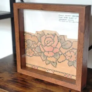 Scrap of old wallpaper, found under other layers of wallpaper, during demo. This is displayed in the living room.