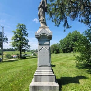 Angel Statue on a grassy hillside