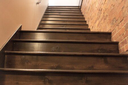 Wooden staircase leading up to the Suite on Jackson loft entrance