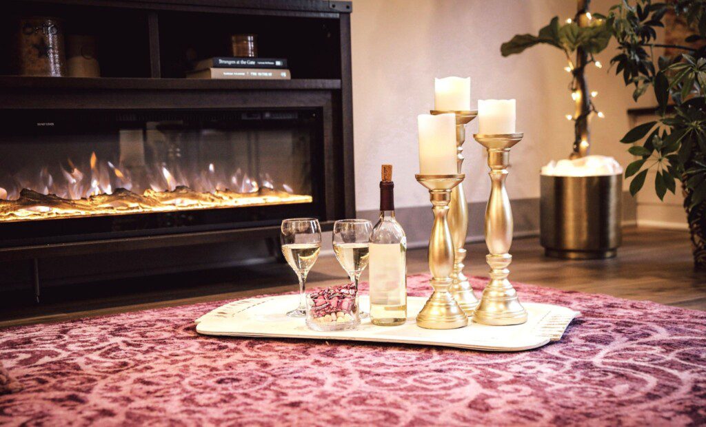 Romance starts with candles, a bottle of wine, and a fireplace.
