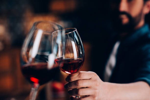 Couple toasting with red wine on a romantic getaway in Ohio's Amish Country